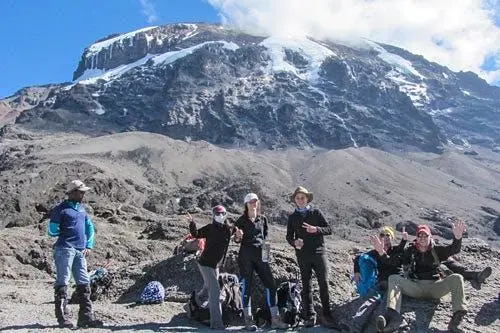 Tourists at the peak of Mt. Kilimanjaro Mountaineering Safari