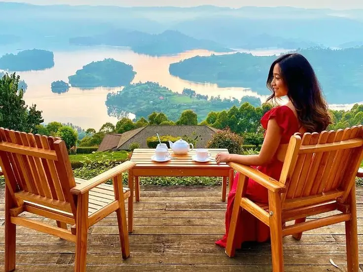 Lake Bunyonyi view a happy client enjoying lake Bunyonyi